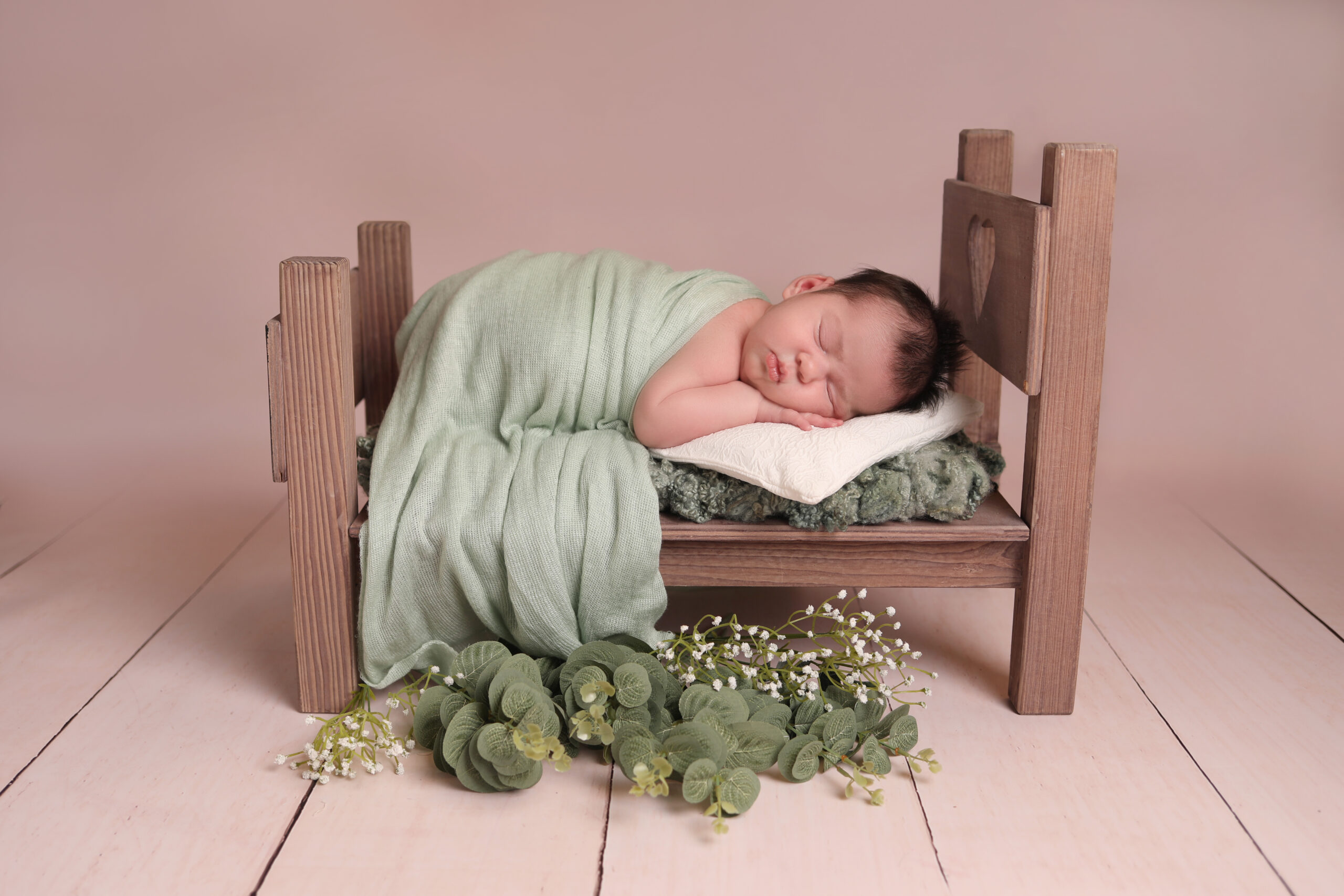 newborn photography studio baby girl green bed Liverpool