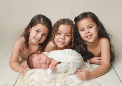 Family Portrait Photoshoot Peekaboo Liverpool siblings with newborn baby simple neutral them