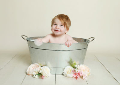 Little sitters baby toddler Photoshoot Peekaboo Liverpool baby in tin bath tub with flowers