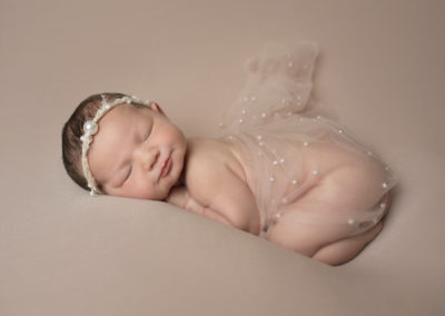 Newborn photoshoot Peekaboo Liverpool simple neutrals with pearl detail wrap