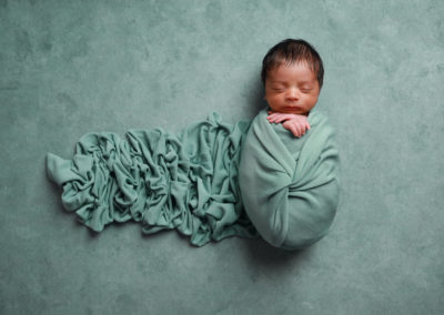 Newborn photoshoot Peekaboo Liverpool mint green draped wrap on mint background