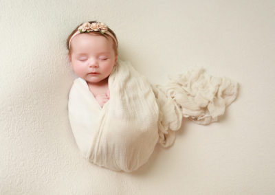 Newborn photoshoot Peekaboo Liverpool creamy neutral wrap
