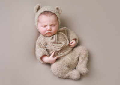Newborn photoshoot Peekaboo Liverpool teddy bear outfit & hat on neutral backdrop