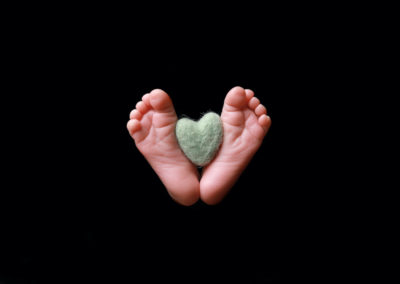 Newborn photoshoot Peekaboo Liverpool baby feet with tiny heart