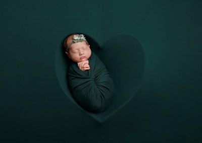 Newborn photoshoot Peekaboo Liverpool deep green heart
