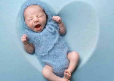 Newborn photoshoot Peekaboo Liverpool baby blue heart withe bonnet