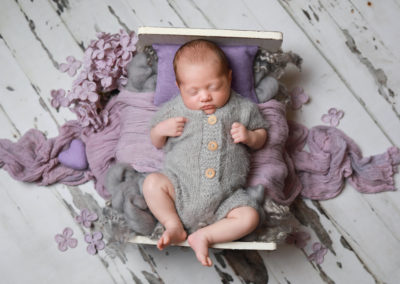 Newborn photoshoot Peekaboo Liverpool lilac grey bed